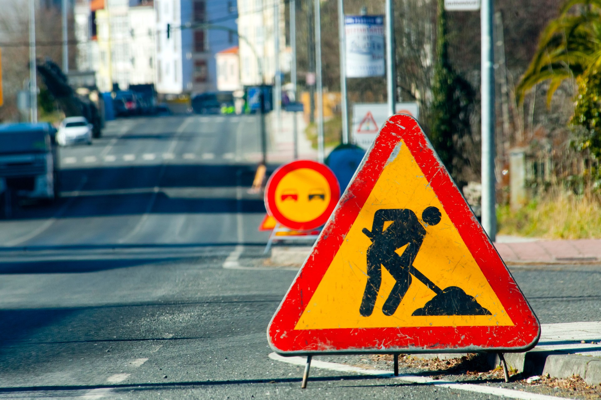Road work ahead sign, urban road, danger ahead warning .